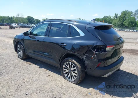 2020 Ford Escape Titanium z USA, uszkodzony, nr VIN 1FMCU9J92LUA27373